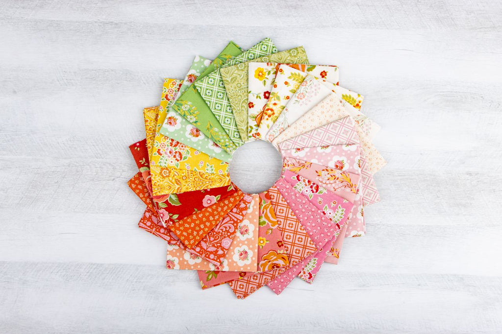 Colorful fabric swatches arranged in a circular pattern on a white background