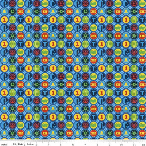 Patterned fabric with colorful symbols on a blue background