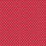 Red fabric with small white polka dots