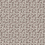 Textured fabric pattern with small floral design on a gray background