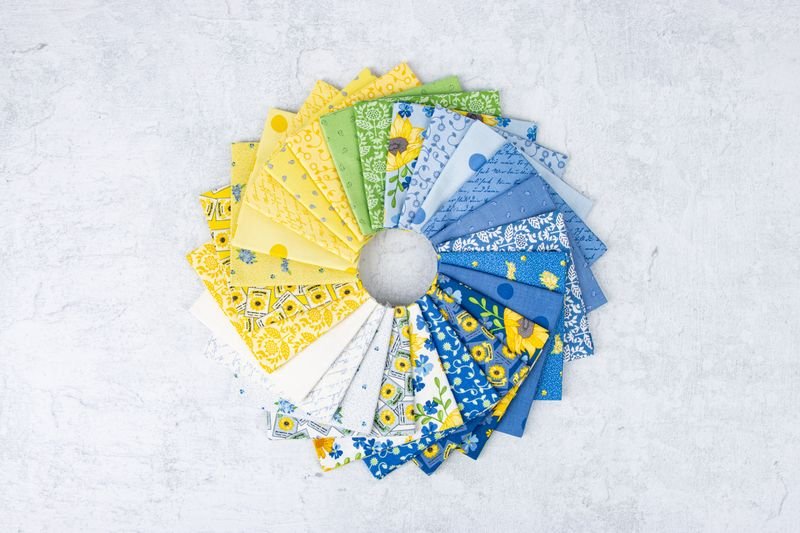 Set of colorful fabric squares arranged in a circular pattern on a light gray background