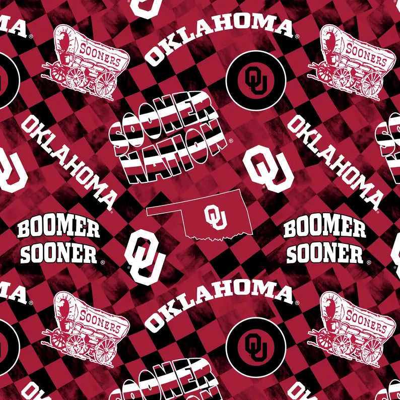 Oklahoma Sooners fabric pattern with logos and text on a red and black checkered background