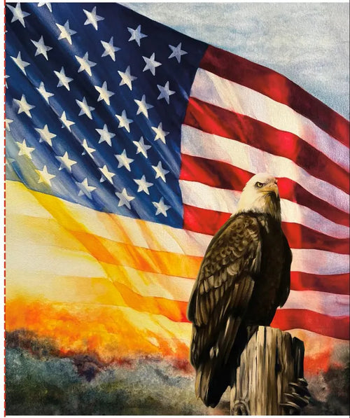 Bald eagle perched on a pole with an American flag in the background